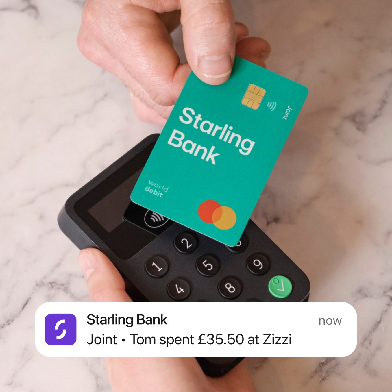 A green coloured starling bank debit car being used to make a contactless purchase for £35.50 at Zizzi
