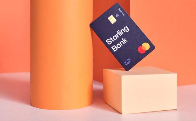 A Starling business debit card balanced on an orange pedestal